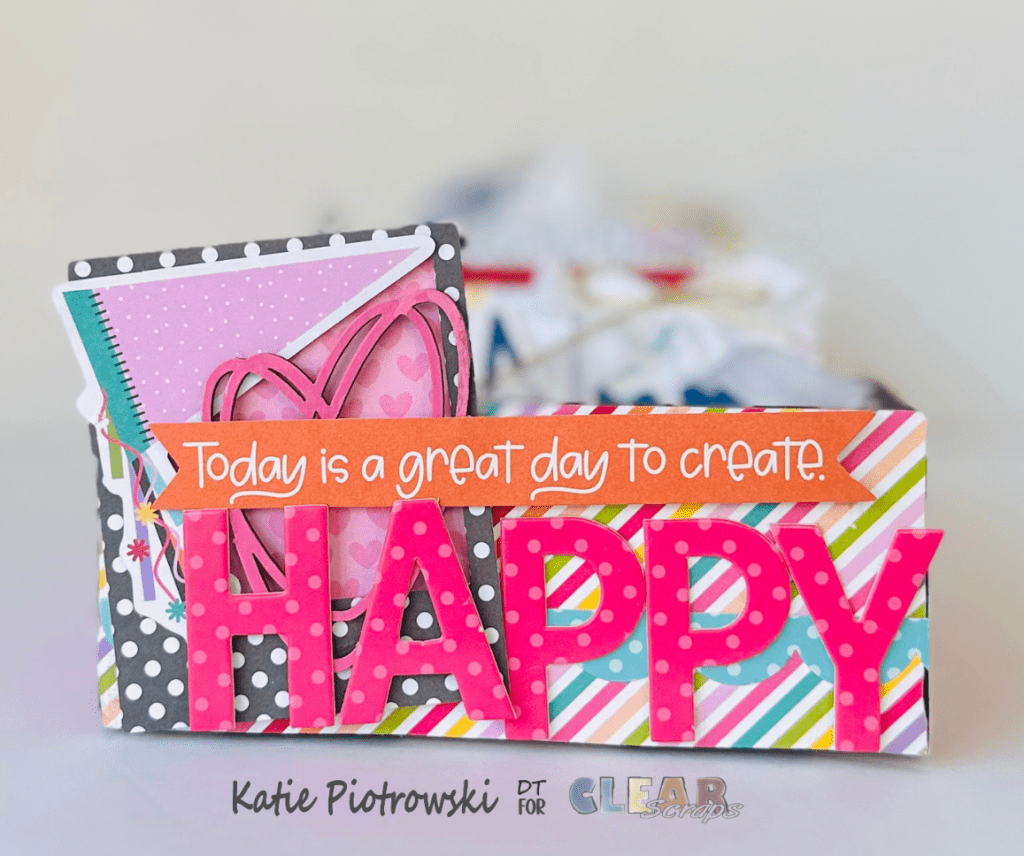 Colorful craft project featuring a decorative box with the text 'Today is a great day to create' and the word 'HAPPY' prominently displayed.